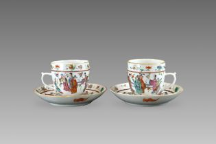 A Pair of 'famille rose' Cups and Saucers with Figures, six character iron red seal marks of Tongzh