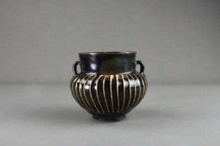 A Cizhou Black-glazed Ribbed Handled Jar, Song dynasty
