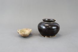 An Early Celadon Earcup and A Black-glazed Jar, Han dynasty and Song dynasty