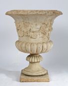 A RECONSTITUTED STONE GARDEN URN.