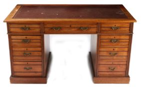 AN EDWARDIAN MAHOGANY TWIN PEDESTAL DESK BY SHOOLBRED & CO.