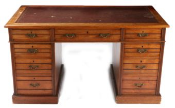 AN EDWARDIAN MAHOGANY TWIN PEDESTAL DESK BY SHOOLBRED & CO.