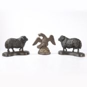 THREE CAST IRON DOORSTOPS (3).