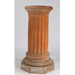 A THOMAS & CO TERRACOTTA PEDESTAL.