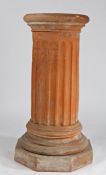 A THOMAS & CO TERRACOTTA PEDESTAL.