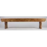 A RUSTIC PINE LOW BENCH.
