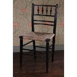 A LATE 19TH CENTURY WILLIAM MORRIS EBONISED CHAIR.