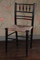 A LATE 19TH CENTURY WILLIAM MORRIS EBONISED CHAIR.