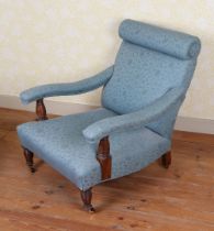 A HOWARD AND SONS TYPE ARMCHAIR.