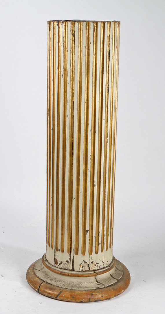 A WHITE AND GOLD PAINTED COLUMN.