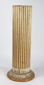 A WHITE AND GOLD PAINTED COLUMN.