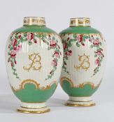 A PAIR OF RARE 18TH CENTURY WORCESTER OVAL TEA CANISTERS, HAND PAINTED WITH ONGLAZE COLOURS.