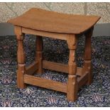 A ROBERT "MOUSEMAN" THOMPSON OAK STOOL.