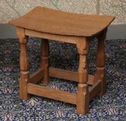 A ROBERT "MOUSEMAN" THOMPSON OAK STOOL.