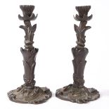 A PAIR OF VICTORIAN BRONZE CANDLESTICKS.