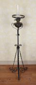 A 19TH CENTURY IRON STANDARD LAMP.