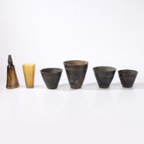 A HORN POWDER FLASK, BEAKER AND FOUR TAPERING VESSSELS (6).