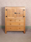 A ROBERT "MOUSEMAN" THOMPSON OAK CABINET.