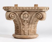 A CARVED OAK IONIC COLUMN CAPITAL.