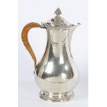 A FINE GEORGIAN SILVER COFFEE POT BY PARKER AND WAKELIN.