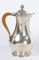 A FINE GEORGIAN SILVER COFFEE POT BY PARKER AND WAKELIN.