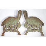 A PAIR OF VICTORIAN CAST IRON BENCH ENDS MODELLED AS CRANES.