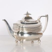 A GEORGE III SILVER TEAPOT.