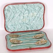 A SET OF FOUR VICTORIAN SILVER BERRY SPOONS.