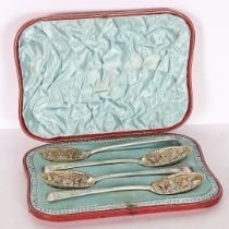 A SET OF FOUR VICTORIAN SILVER BERRY SPOONS.