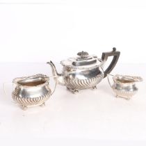 AN EDWARD VII SILVER THREE PIECE TEA SET.