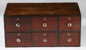 A VICTORIAN BANK OF SIX APOTHECARY DRAWERS.