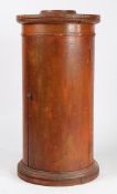 A VICTORIAN RED PAINTED CYLINDRICAL POT CUPBOARD.