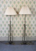 A PAIR OF REGENCY STYLE BRASS ADJUSTABLE STANDARD LAMPS.