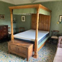 A 20TH CENTURY OAK FOUR POSTER BED.