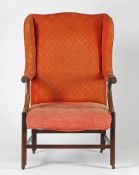 A 18TH CENTURY WING BACK ARMCHAIR.