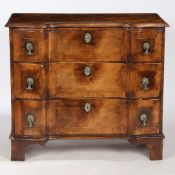 A 18TH CENTURY DUTCH WALNUT SERPENTINE CHEST OF DRAWERS OF NARROW PROPORTIONS.