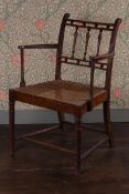 AN ARTS AND CRAFTS MENDLESHAM TYPE WALNUT ARMCHAIR.