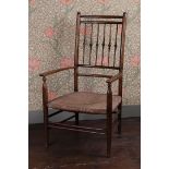 A LATE 19TH CENTURY LIBERTY & CO. ARMCHAIR