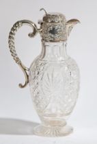 AN EDWARD VII SILVER MOUNTED CLARET JUG.