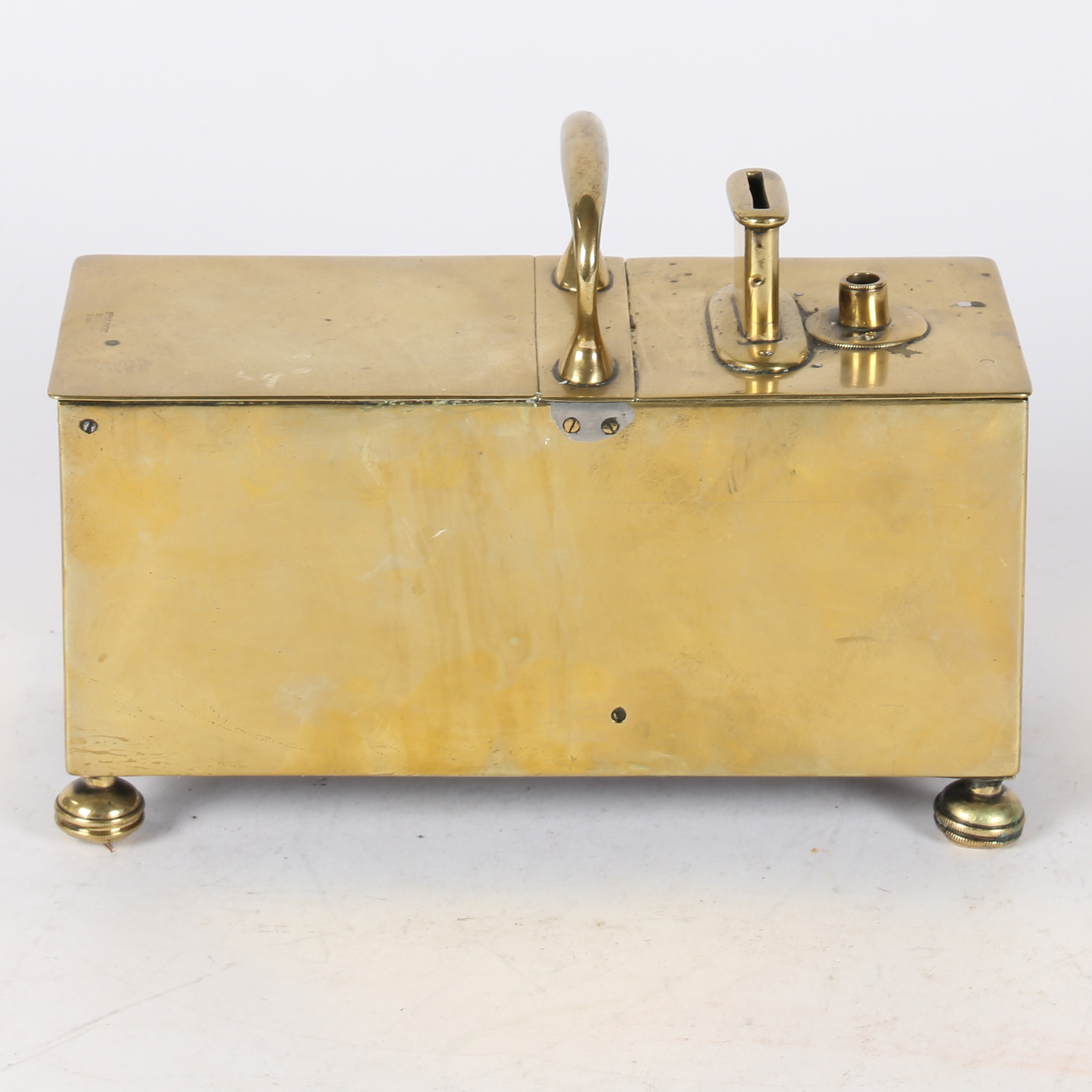 A 19TH CENTURY BRASS "GILBERT" PATTERN HONESTY BOX.