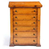 A VICTORIAN MAPLE WELLINGTON CHEST OF SMALL PROPORTIONS.