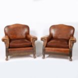 A PAIR OF LEATHER DEEP SEATED ARMCHAIRS.