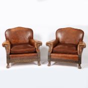 A PAIR OF LEATHER DEEP SEATED ARMCHAIRS.