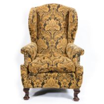 A GEORGE III WINGBACK ARMCHAIR.