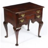 A GEORGE III OAK LOWBOY.