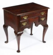 A GEORGE III OAK LOWBOY.