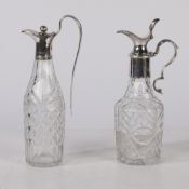 TWO EARLY 19TH CENTURY SILVER MOUNTED CRUET BOTTLES.