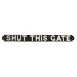 A 20TH CENTURY RAILWAY CAST IRON 'SHUT THIS GATE' SIGN.