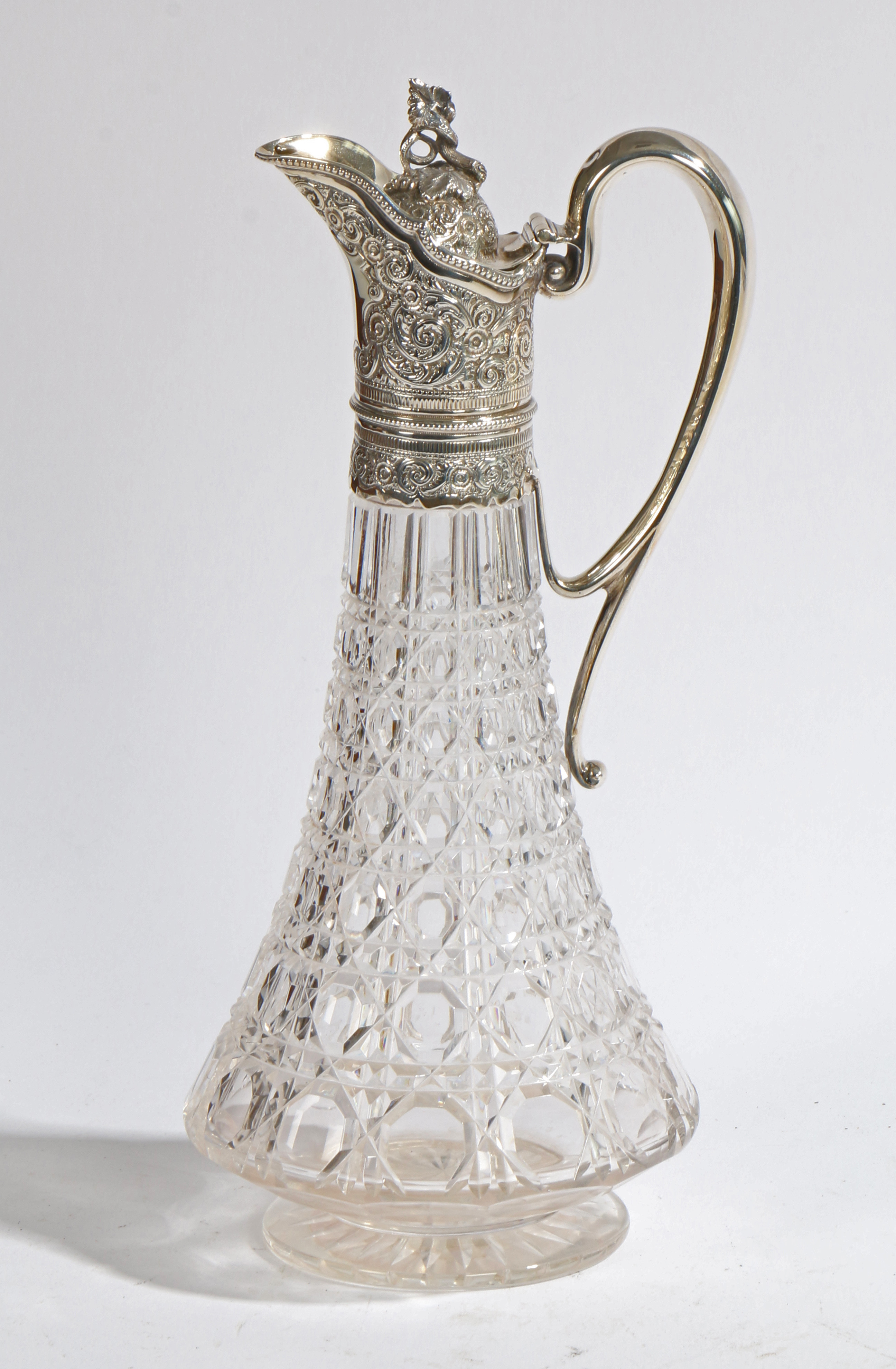 A VICTORIAN SILVER MOUNTED CLARET JUG.