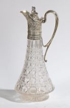 A VICTORIAN SILVER MOUNTED CLARET JUG.